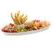 A Tablecraft white cast aluminum fish platter with meat, cheese, and olives.