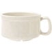 A white mug with speckled black accents.