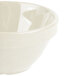 A close-up of a white GET Santa Fe melamine bowl with a handle.