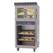 A Doyon bakery convection oven with trays of bread on racks.
