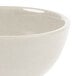 A white Santa Fe Ironstone bowl with a speckled design.