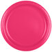 A close-up of a Creative Converting hot magenta pink paper plate with a curved edge.