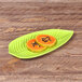 A green Elite Global Solutions Tropicana leaf melamine platter with papaya slices on it.