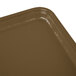A Cambro rectangular bay leaf brown fiberglass tray on a counter.