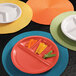 A white Elite Global Solutions melamine dish with four sections filled with vegetables.