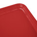 A rectangular red Cambro tray on a counter.