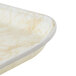 A Cambro trapezoid fiberglass tray with a marble pattern and gold trim.