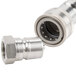 A T&S Safe-T-Link stainless steel water appliance hose with a threaded metal nut.