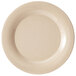 A beige plate with a white speckled rim.