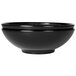 A close-up of a black Elite Global Solutions Sunburst melamine bowl with a rim.