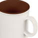 A white GET Tritan mug with a brown rim.