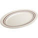A white oval platter with brown lines on the rim.