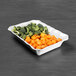 A white rectangular melamine dish with broccoli and carrots on it.