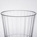 A close up of a clear Fineline Renaissance plastic tumbler with a curved rim.