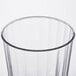 A close up of a Fineline clear hard plastic crystal tumbler with a rim.