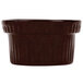 A brown Tablecraft cast aluminum souffle bowl with ridges on the sides.