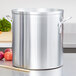 A large silver Vollrath Wear-Ever aluminum stock pot on a counter.
