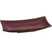 A maroon cast aluminum rectangular platter with a curved edge and handles.