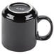 A black CAC Venice Stacking Mug with a silver rim on a counter.