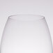 A close up of a clear Chef & Sommelier universal wine tasting glass.