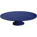 A blue speckled cast aluminum round cake stand with a pedestal.