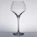 A clear Chef & Sommelier Tannic wine glass on a table.