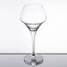 A clear Chef & Sommelier wine glass on a table.