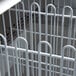An Avantco white metal divider with curved rods.