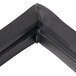 A black plastic corner piece with a black rubber edge for a True 810802 equivalent magnetic door gasket.