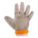 An extra-large hand wearing an orange Victorinox chain mail glove.