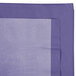 A purple table cover with a white border.