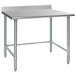 A stainless steel Eagle Group work table with a backsplash and metal legs.
