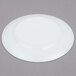 An Arcoroc white glass bread and butter plate with a circular design on the edge.