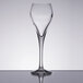 An Arcoroc Malea Brio wine glass on a table with a reflection.