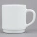 An Arcoroc white stacking mug with a handle.