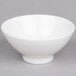 A Tuxton porcelain white mini round china bowl with a small rim.