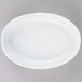 A white oval porcelain serving platter.