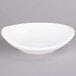 A Tuxton porcelain white oval bowl with a small rim.