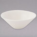 A Tuxton eggshell white china bowl with a triangle shape.