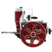 A red and silver Berkel Prosciutto meat slicer.