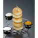 An American Metalcraft round onion ring tower with different dips on a table.