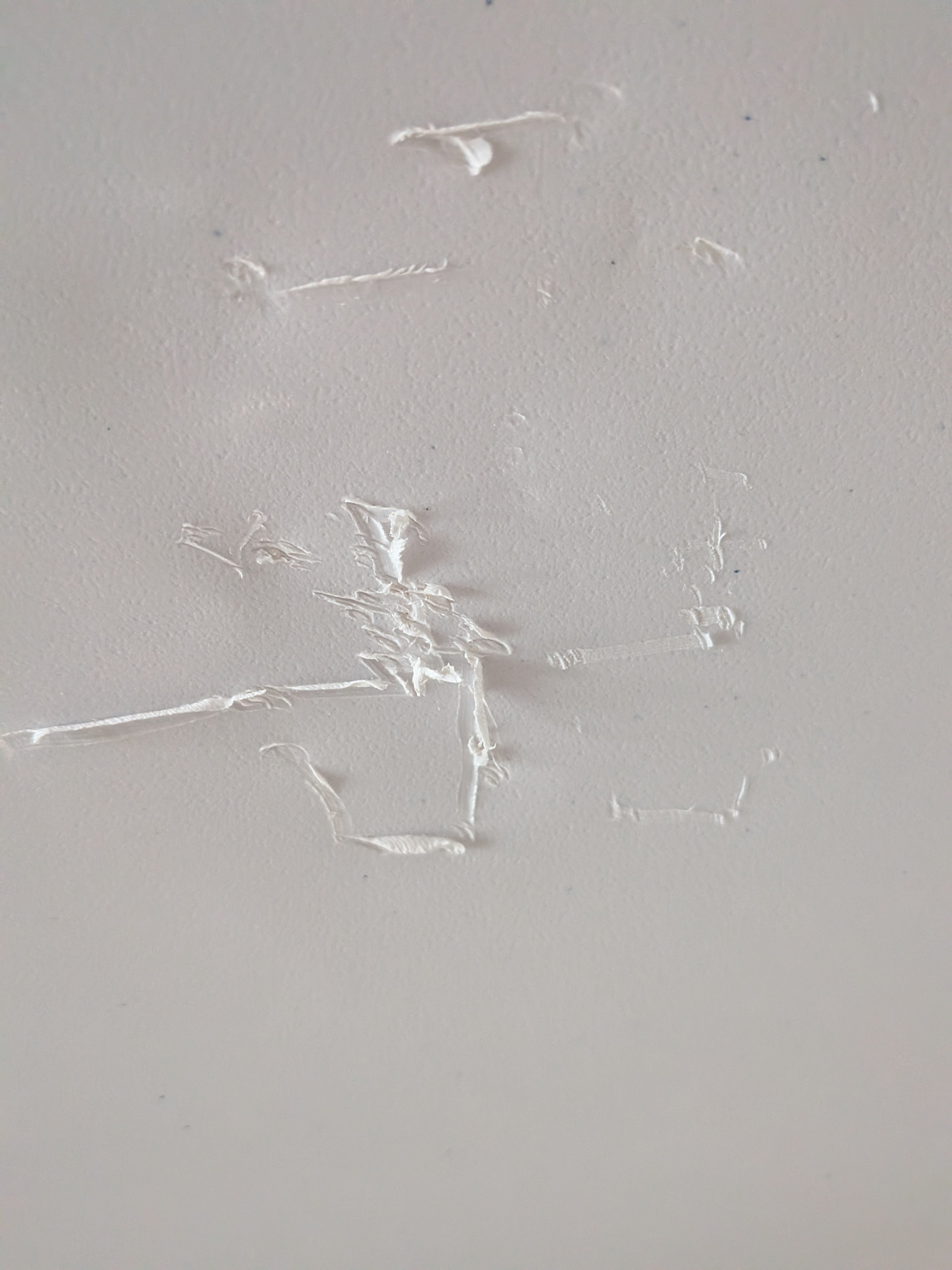scratch marks on tabletop due to nail in skid