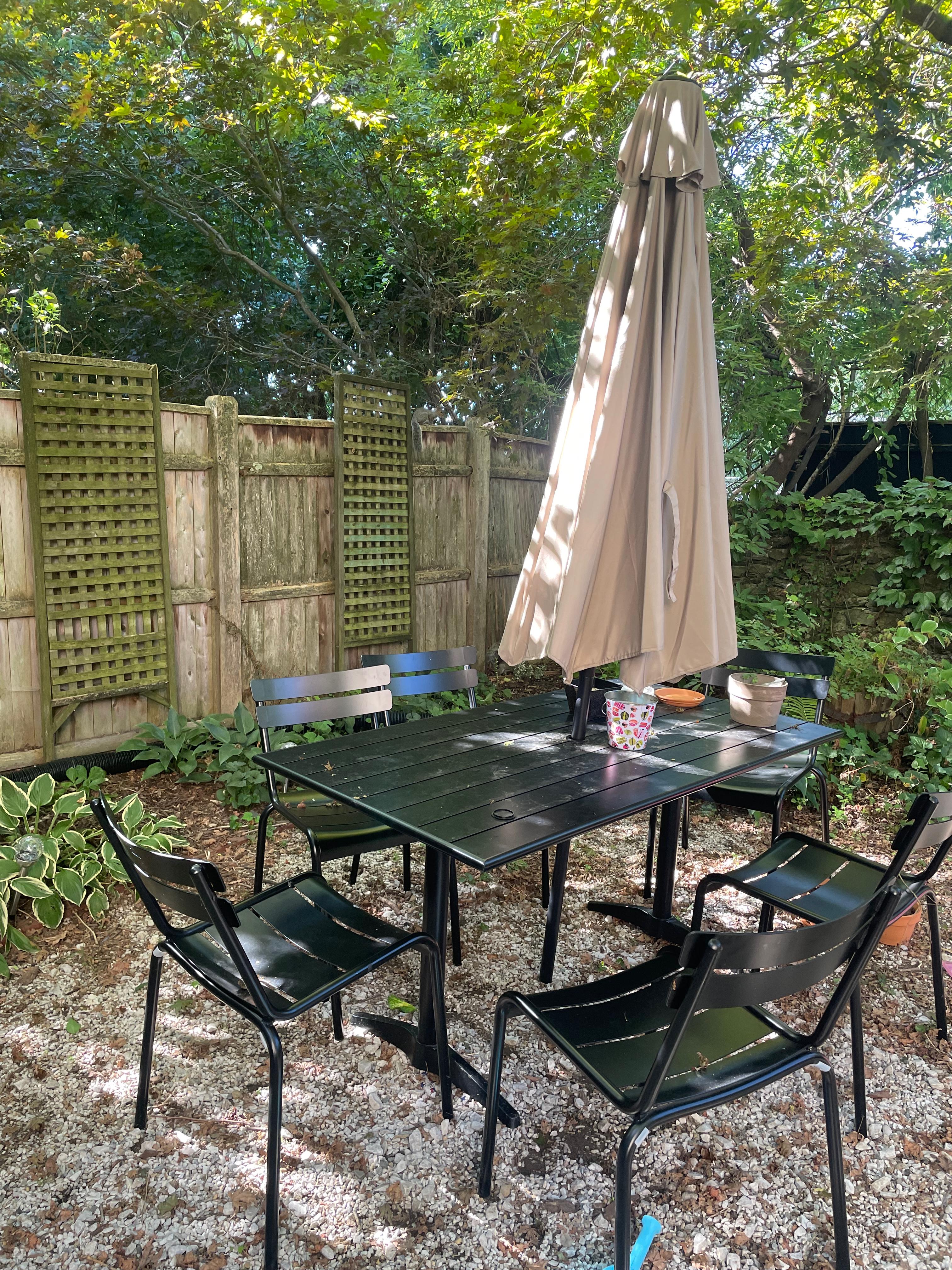 Table and chairs in back yard