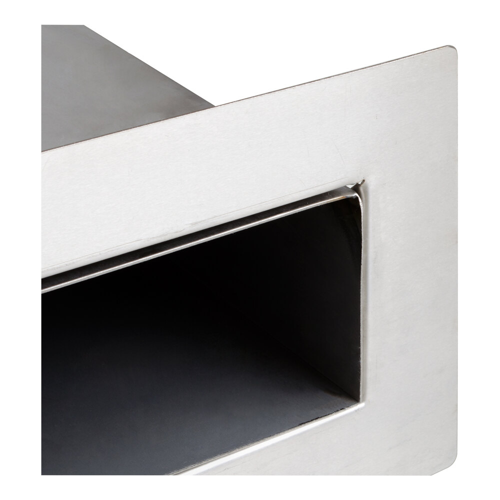 A close-up view of a rectangular stainless steel vent duct with a brushed finish.