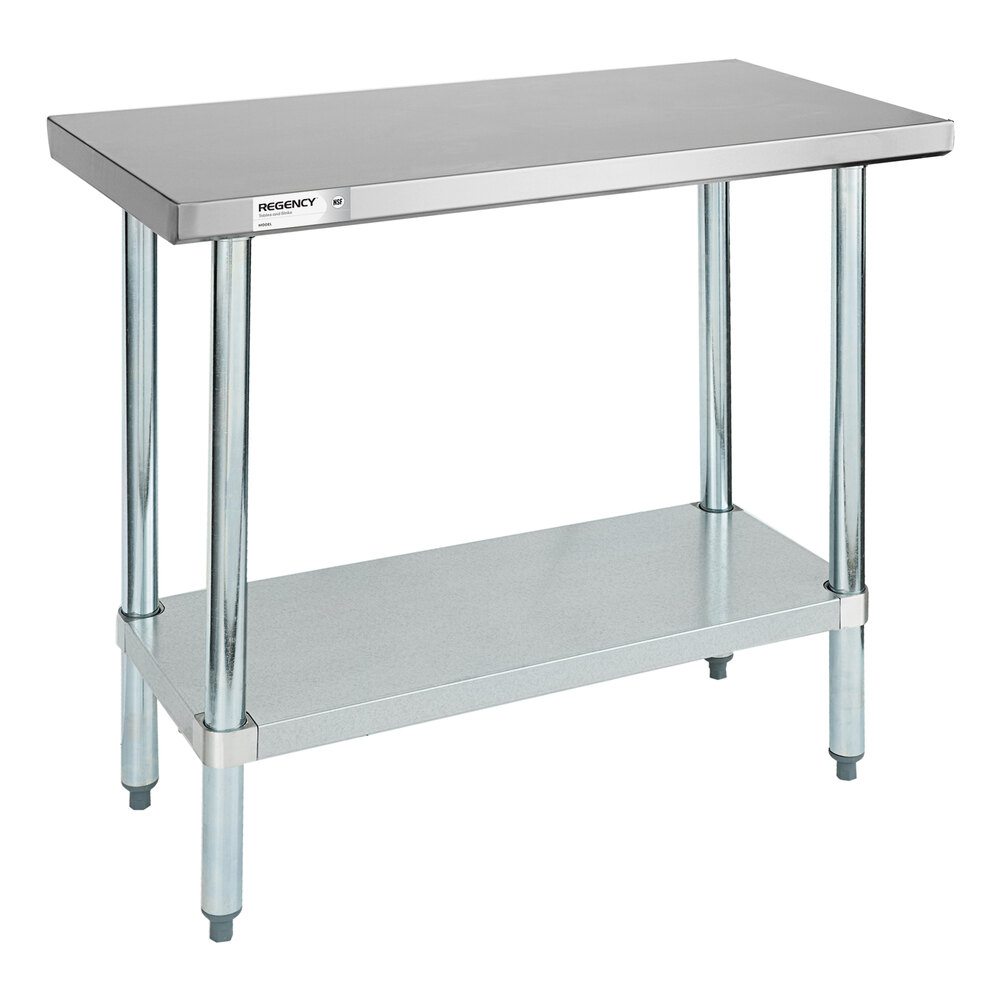 A metal work table with a flat top surface, four cylindrical legs, and a lower shelf.
