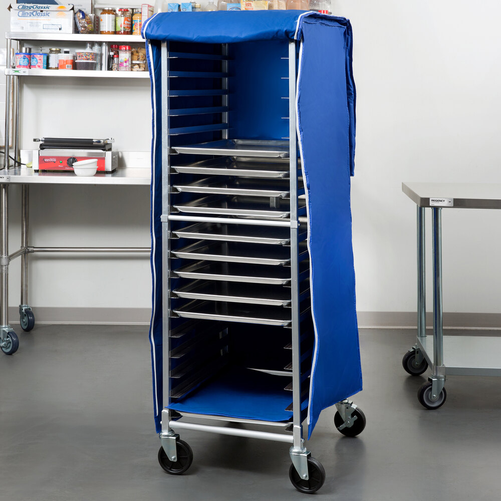 A blue insulated polyester cover on a tall bun pan rack with multiple shelves and wheels.
