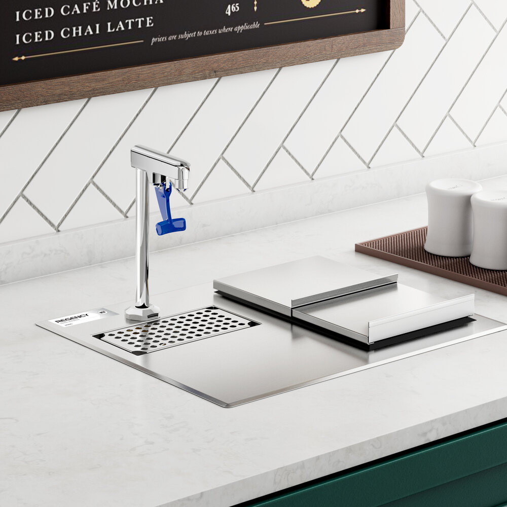 A stainless steel water station with a faucet, drip tray, and covered ice bin installed in a countertop.