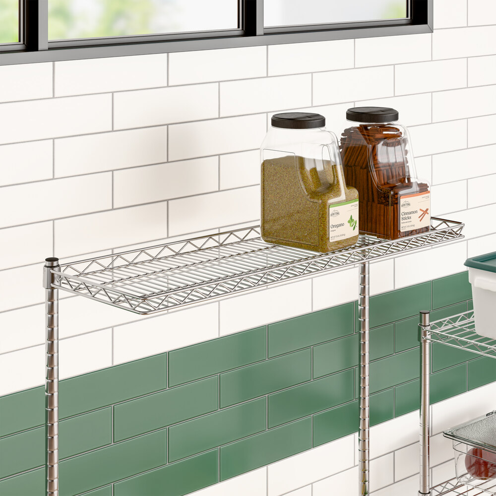 A chrome wire cantilever shelf measuring 12 inches by 36 inches, mounted on a wall.