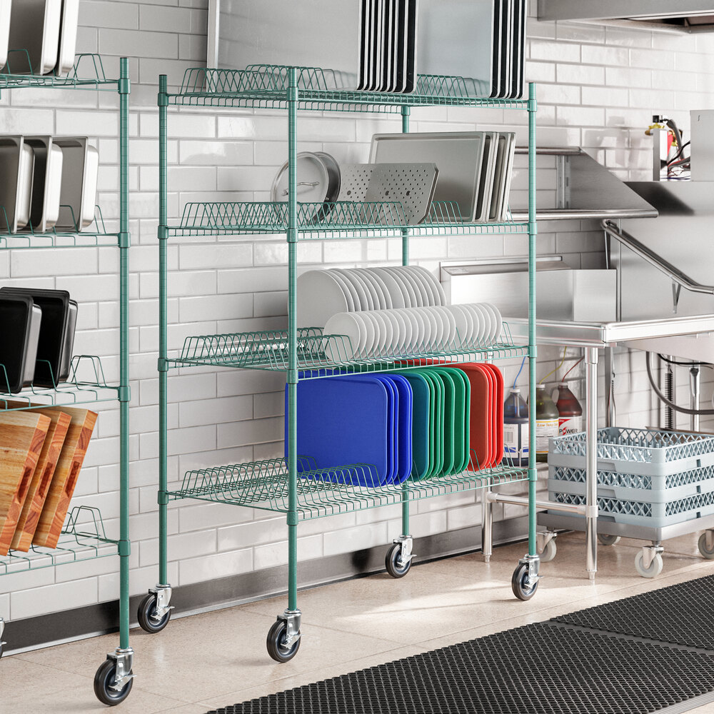 A green Regency wire rack with trays on it.