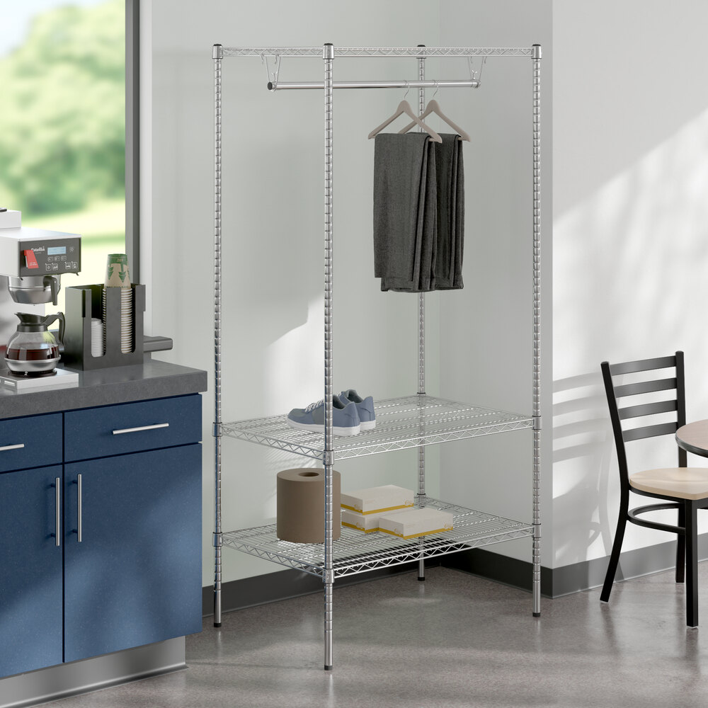 A Regency chrome wire garment rack filled with clothes.